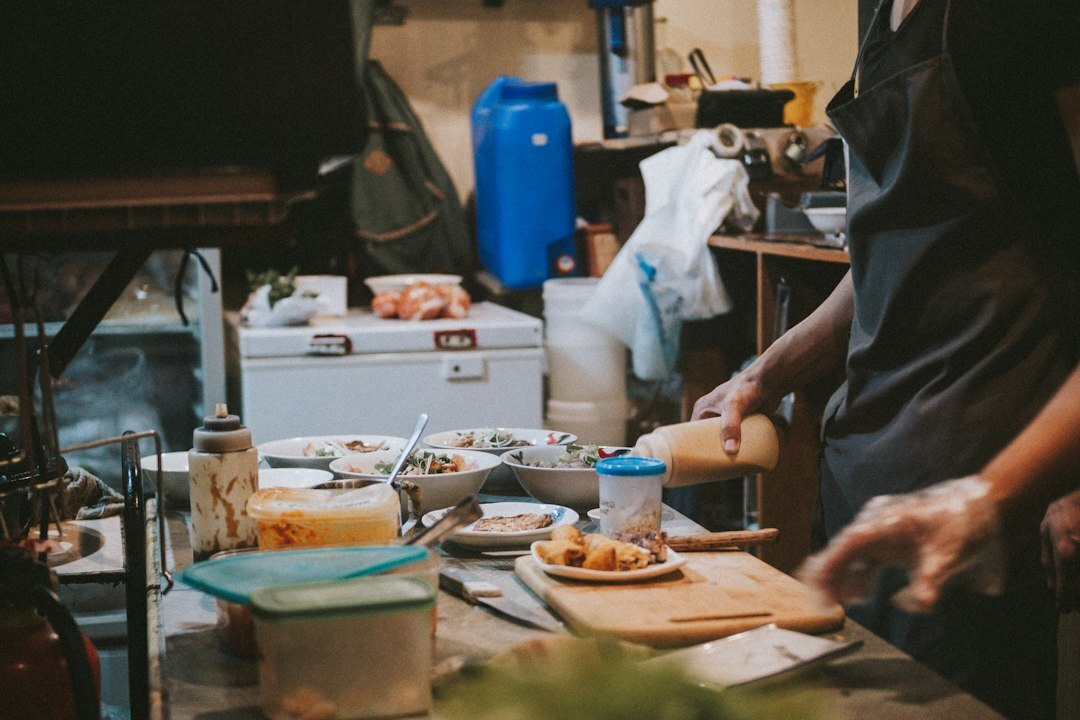 Two Czech people cooking together in a home kitchen