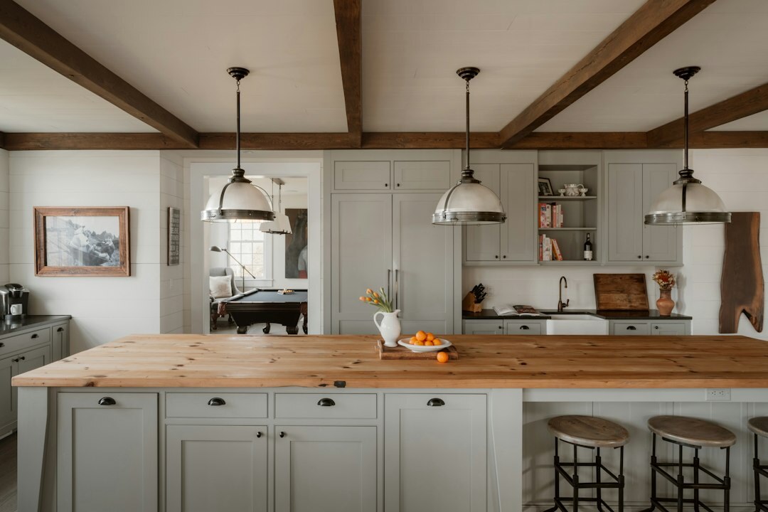 Warm modern Czech home kitchen with wooden countertop and fresh ingredients